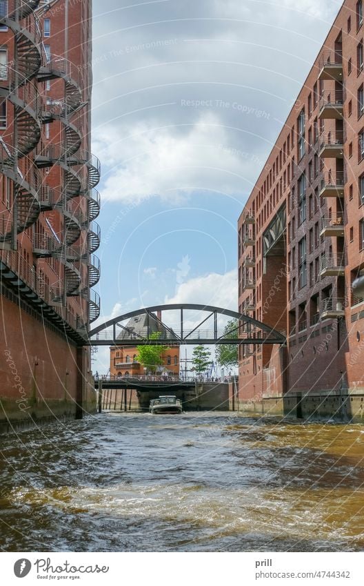 Speicherstadt in Hamburg speicherstadt hamburg warehouse district germany old historic hafen city canal bridge facade house facade brick brick wall