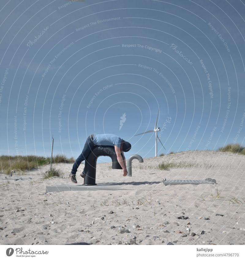 die luft ist raus Frischluft tanken Rohrleitung Windrad Düne Dünengras Sand Nordsee liegen Mensch atmen Atem Sauerstoff Betankung Landschaft Natur Farbfoto