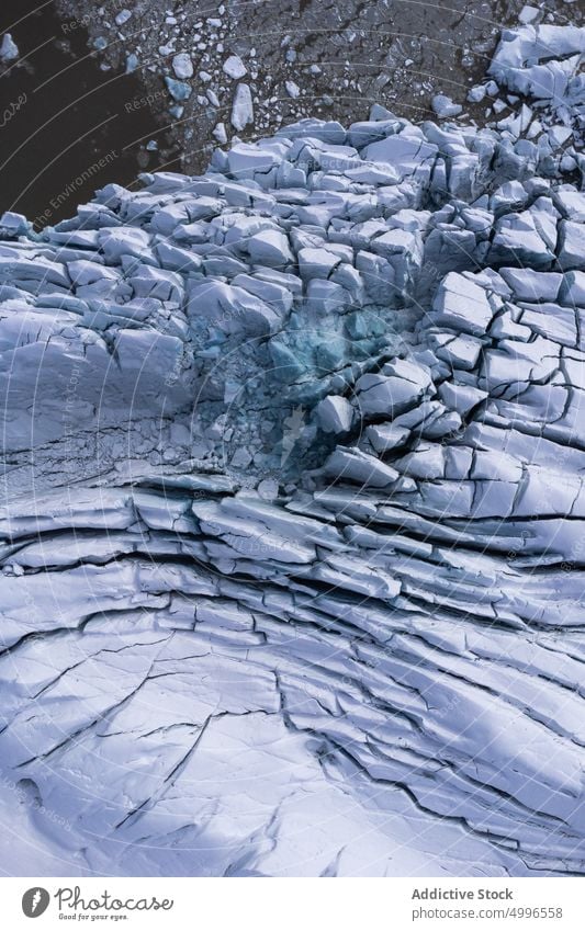 Landschaftlich reizvolles Vulkangelände mit strukturiertem Gletscher Eis gefroren Winter Textur Hintergrund massiv Formation vulkanisch Natur Oberfläche rau