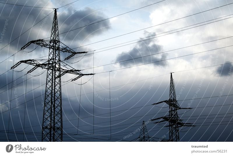 Opening. Strommast Stahl Elektrizität stark Starkstrom Wolken Regen Leitung Himmel Industriefotografie industrial Wattenmeer Kabel blau Sonne Natur