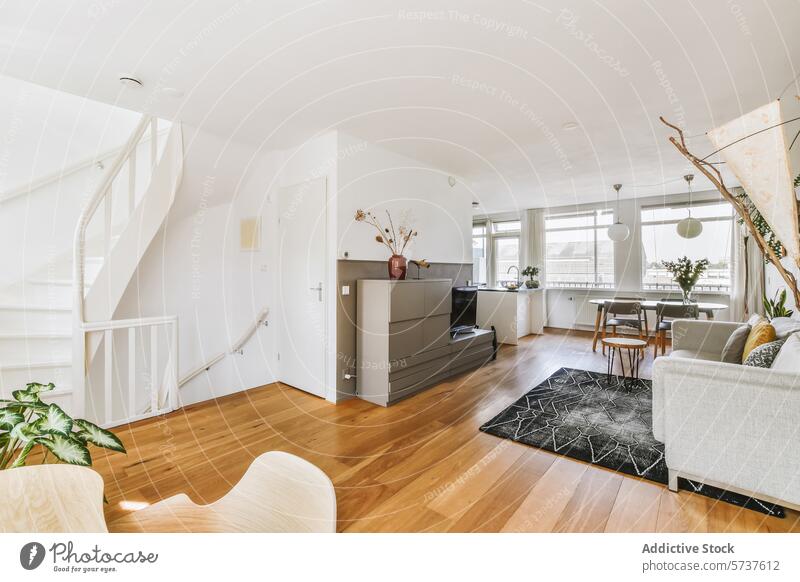 Modernes Wohnzimmer mit Treppe und Tageslicht Innenbereich modern Treppenhaus Spirale Holzfußboden Licht Fenster Möbel stylisch Design geräumig heimwärts