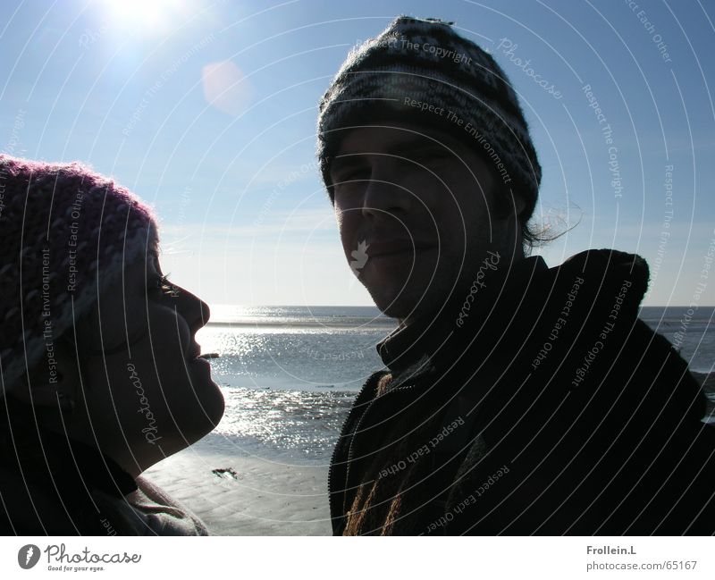 Julia und Jörg Meer Strand Winter Februar St. Peter-Ording Mütze Sonntag blenden Gegenlicht Zwinkern Liebe Licht Sonne Wasser Paar sea sun february water couple