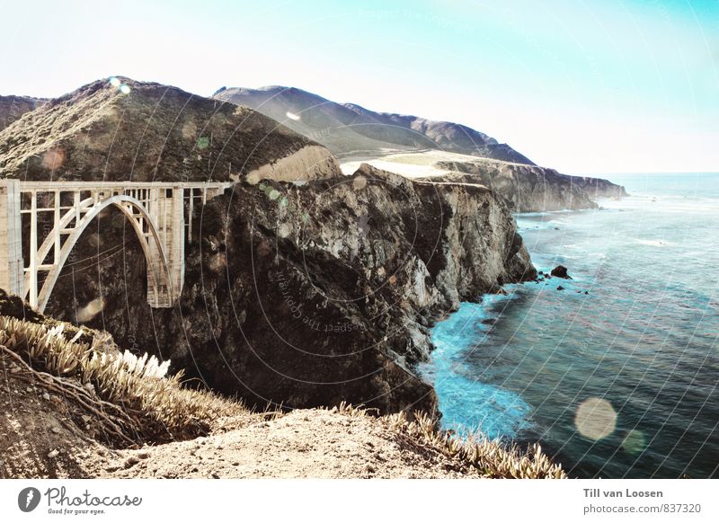 Bixby Bridge Umwelt Natur Landschaft Urelemente Wasser Himmel Wolkenloser Himmel Sommer Küste Meer Bauwerk Architektur Sehenswürdigkeit Straße groß