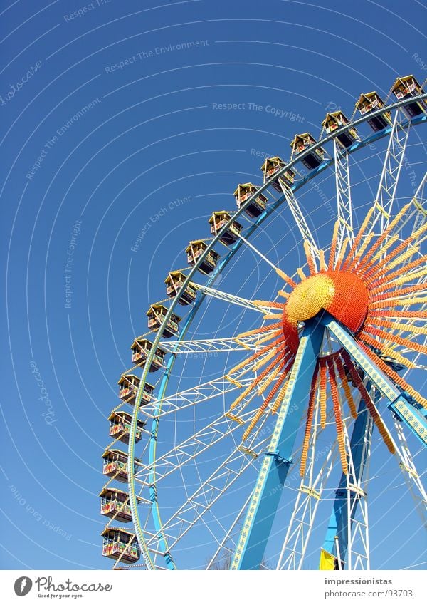 around and around Jahrmarkt Riesenrad Hamburger Dom gelb Nervenkitzel Freizeit & Hobby Freude Spielen blau orange Himmel