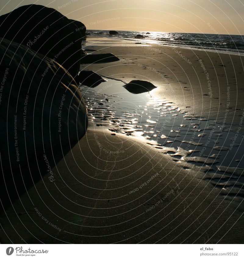 nordstrand Strand Meer Küste Wellen glänzend Licht Sonnenuntergang dunkel Ferien & Urlaub & Reisen Rügen Stein Bruchstück Felsen sommer sonne herzinfakt