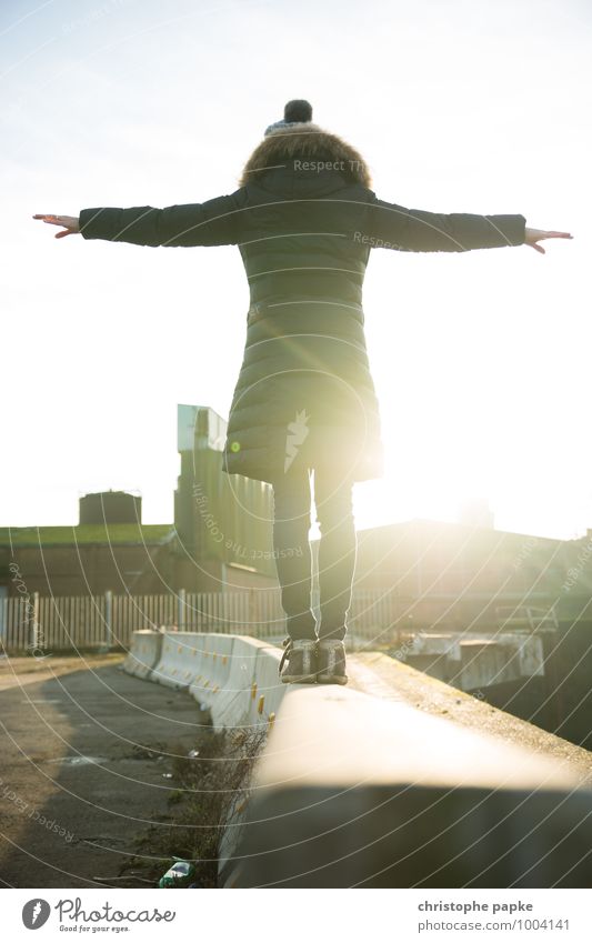 tightrope walk Leisure and hobbies Feminine 1 Human being Outskirts Coat Bright Cold Happy Serene Contentment Colour photo Exterior shot Copy Space top Day