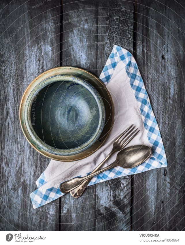 Empty blue bowl with spoon and fork and napkin Crockery Plate Bowl Knives Spoon Style Design Kitchen Wood Retro Blue Background picture Vintage bare