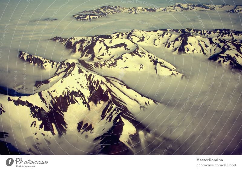 cloud fjord Akureyri Iceland Clouds Bad weather Cloud cover Stick out Permeate Airplane Bird's-eye view Flying Sunlight Light Glacier Winter Aerial photograph