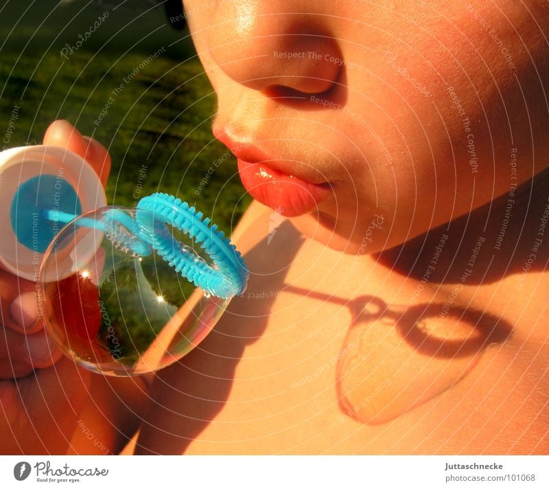 Very carefully Boy (child) Child Soap bubble Blow Summer Playing Toys Human being boy children bubbles game play toy shadow Mouth Face Garden Juttas snail