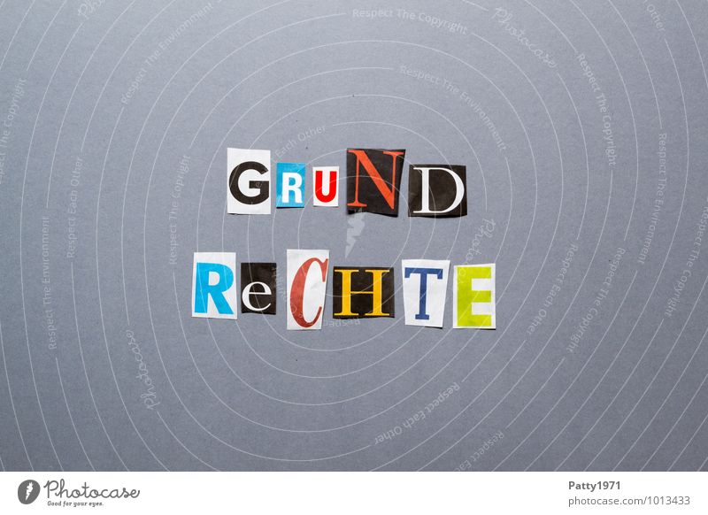 Fundamental rights. Letters cut out of newspaper on a neutral, grey background. Sign Characters Typography Fairness Freedom Politics and state Safety Low-cut