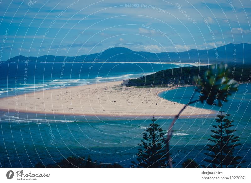 Finally holiday, a lot of sea, sand dune that reaches into the sea, mountains and in the background blue sky. Nambucca Heads, N.S.W / Australia Joy Calm