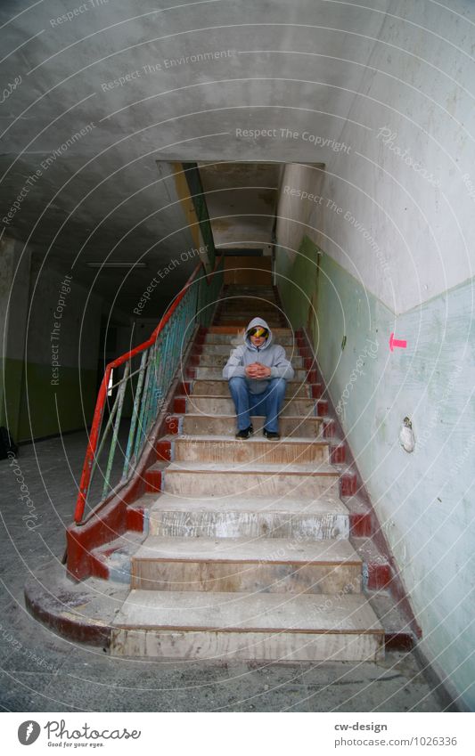 Young person wearing a blindfold sitting on a dusty staircase in an abandoned building in Elstal Stairs Sit Blindfold forsake sb./sth. Building Ruin