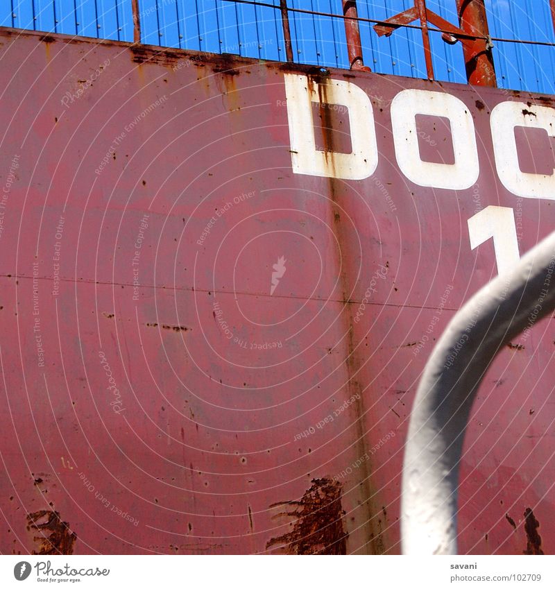 red, white and blue River Port of Hamburg Dock Harbour Wall (barrier) Wall (building) Navigation Container Rust Characters Digits and numbers Blue Red White