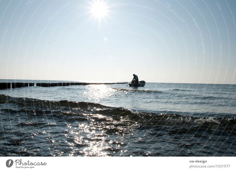 Fisherman with boat at sea Lake groynes Beach