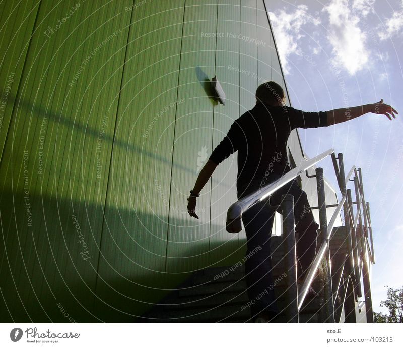 other angle Ascending Dazzle Go up Building House (Residential Structure) Wall (building) Green Dangerous Rod Distress Hoppegarten Posture Light Shadow Bracelet