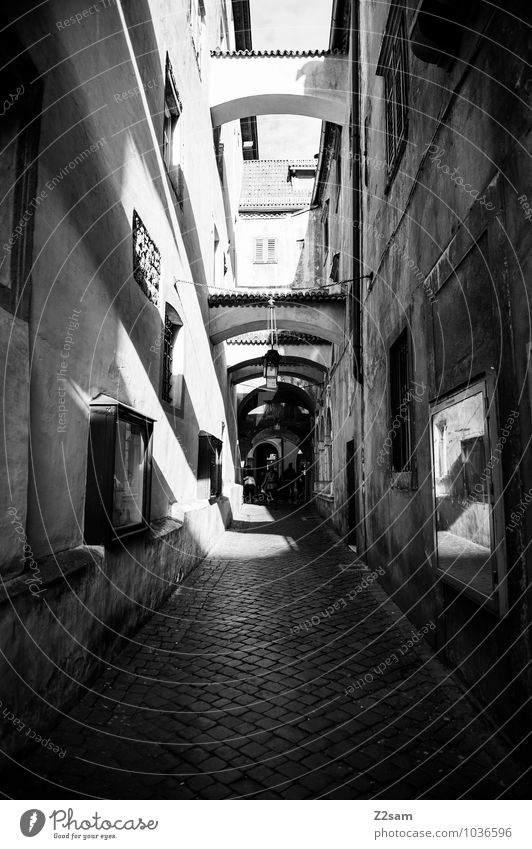 Bolzano Small Town Deserted Architecture Facade Dark Sharp-edged Simple Historic Gloomy Loneliness Nostalgia Perspective Vacation & Travel Calm Moody Symmetry