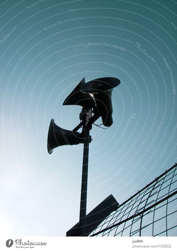 CAN you HEAR me? Loudspeaker Megaphone Microphone To talk Information Speech Fence Grating 3 Stadium Black Sky Radio (broadcasting) Electrical equipment