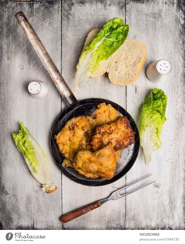 Schnitzel in old pan with meat fork Food Meat Lettuce Salad Bread Nutrition Lunch Banquet Fork Style Design Healthy Eating Life Tradition Escalope Gourmet