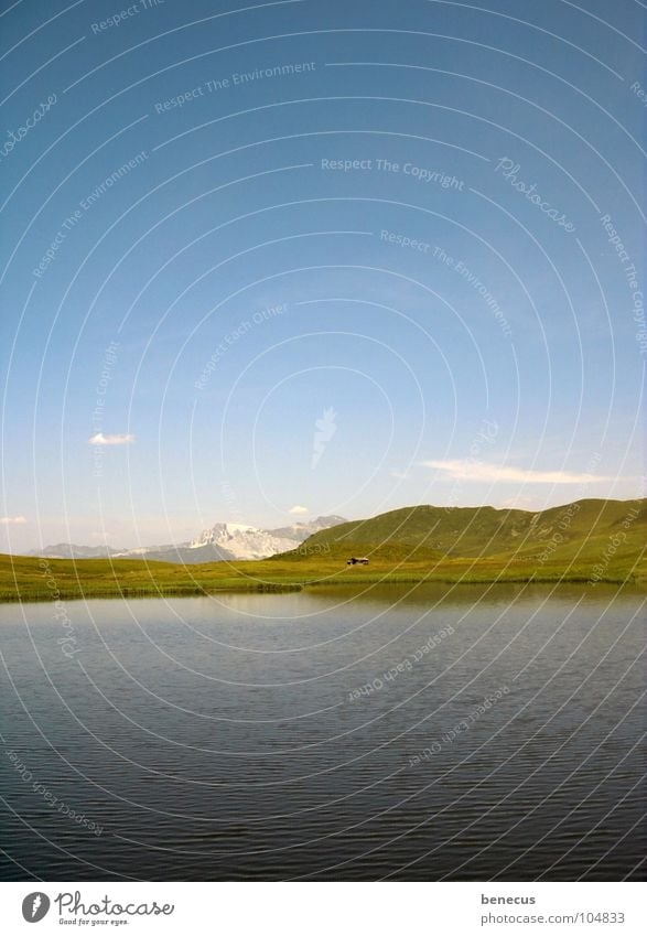 Lonely mountain hut Mountain lake Lake Body of water Peak Hill Green Calm Alpine hut Loneliness Beautiful Summer Golden section Horizon Water Blue Sky