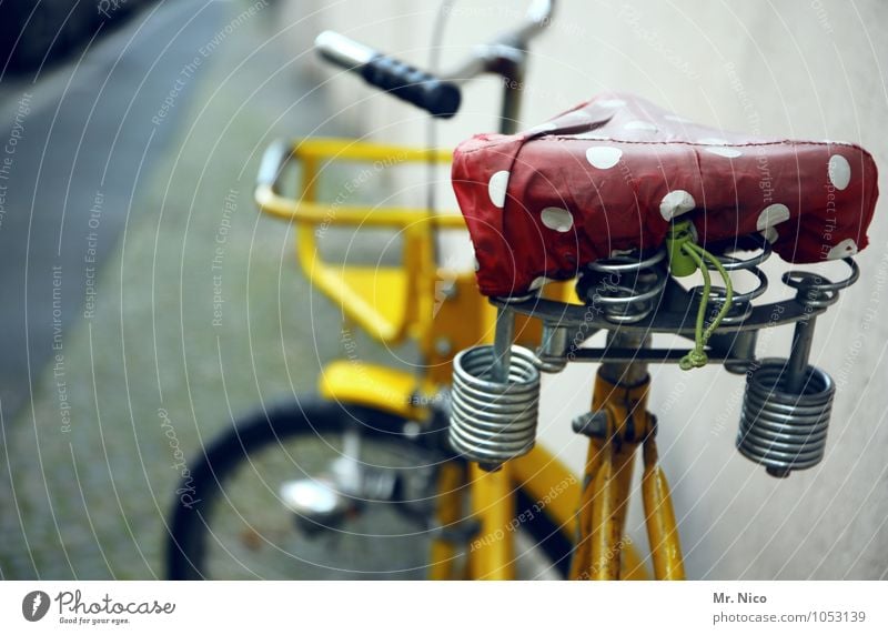 same saddle , different bike Lifestyle Leisure and hobbies Trip Cycling tour Wall (barrier) Wall (building) Road traffic Street Lanes & trails Bicycle Yellow