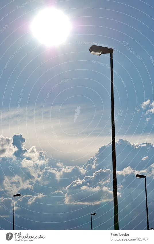 natural vs. artificial light Sunbeam Light Midday Clouds Lamp Street lighting Electricity Sky Celestial bodies and the universe Sun Sunlight light steles