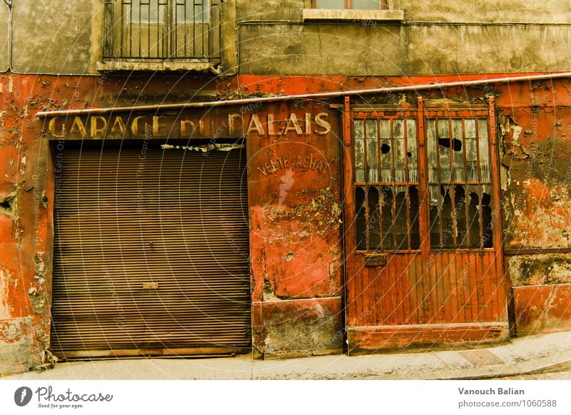 Garage du Palais Town Wall (barrier) Wall (building) Facade Historic Broken Garage door Vintage France Lyon Old Old town Red Beige Going Plaster Rendered facade