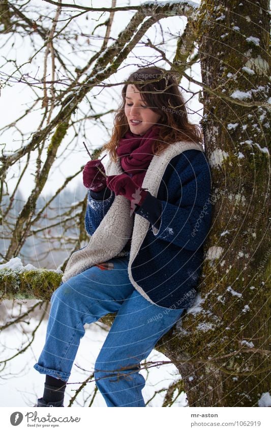 Playing with sticks Human being Feminine Young woman Youth (Young adults) 1 18 - 30 years Adults Tree Branch Fur coat Scarf Gloves Brunette Long-haired Joy