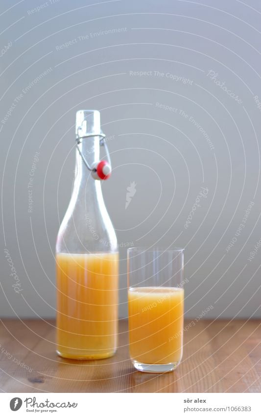 multinational Food Breakfast Beverage Drinking Cold drink Juice Bottle Glass Wooden table Fresh Healthy Vitamin C Colour photo Interior shot Deserted