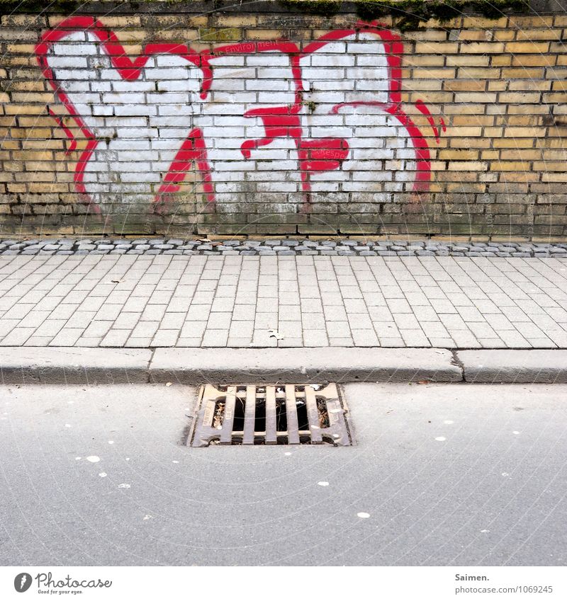 A "YES" for pedestrians Town Wall (barrier) Wall (building) Street Lanes & trails Optimism Curbside Drainage Gully Stone Asphalt Letters (alphabet) Graffiti