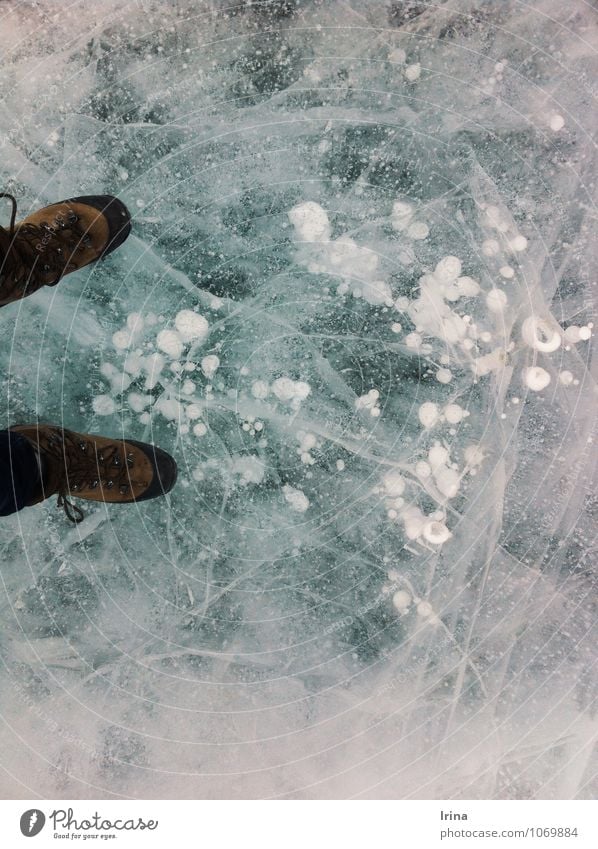 ice wanderer Adventure Winter vacation Elements Ice Frost Lake Footwear Hiking boots Freeze Exceptional Threat Cold Blue Turquoise White Optimism Brave