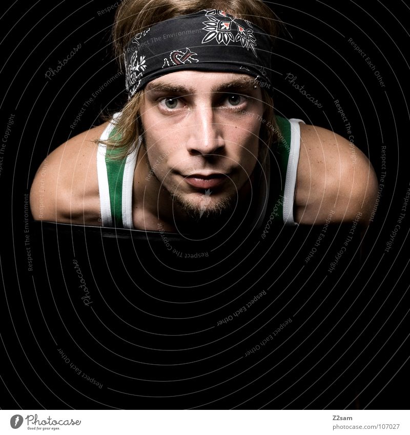 frontal III Frontal Portrait photograph Classic Black Dark Studio shot Rocker Headband Sports top Green Man Youth (Young adults) Looking Shoulder Blonde Chair