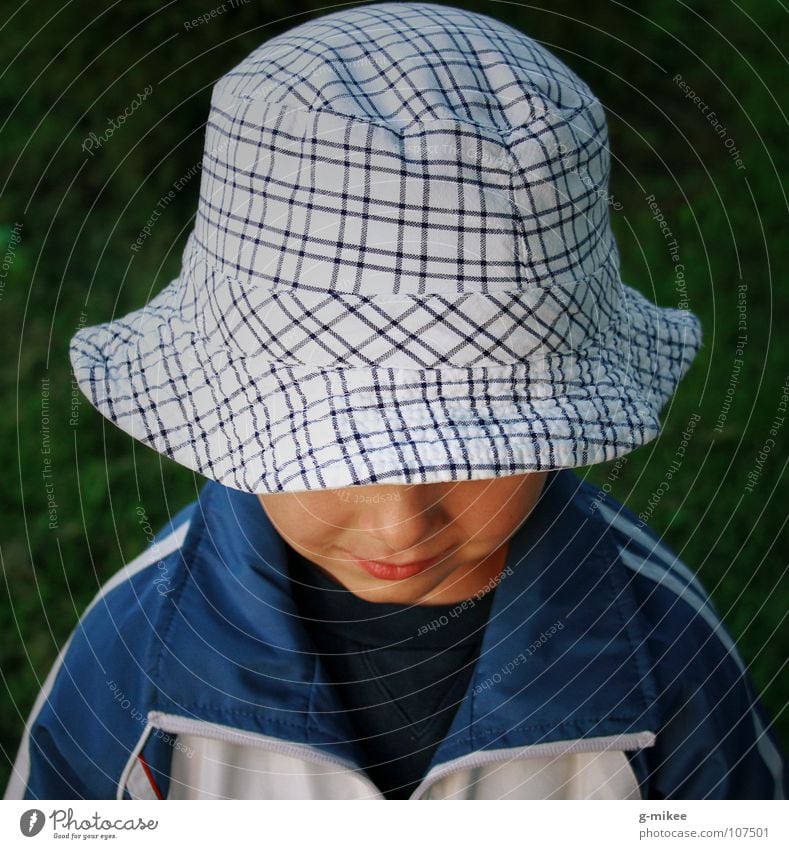 shy boy Face Child Boy (child) Hat Timidity Mysterious Grinning Invisible has grin secret Hide Portrait photograph