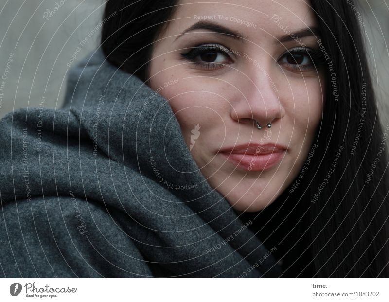 Woman in winter coat Feminine Young woman Youth (Young adults) 1 Human being Coat Piercing Black-haired Long-haired Observe Smiling Looking Wait Elegant pretty