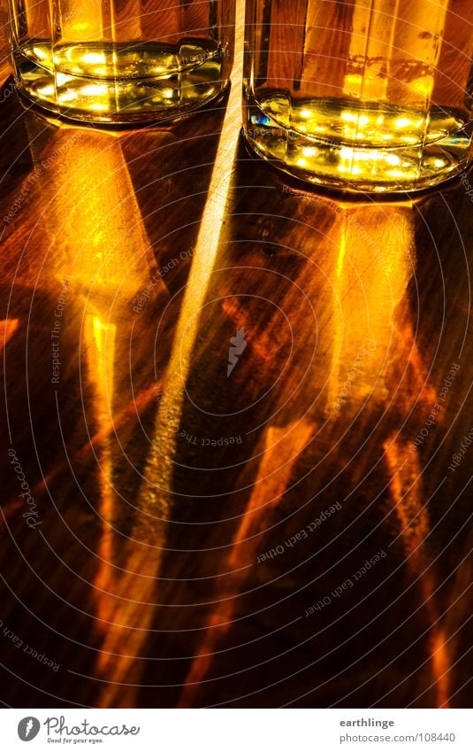 light beer Beer Back-light Refraction Yellow Table Wood Fluid Colour photo Digital photography Portrait format Beer garden Oktoberfest Beer glass Fresh Summer