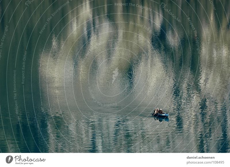 still (almost) the lake rests Calm Loneliness Cyan Rowboat Watercraft Paddling Fishing (Angle) Lake Surface Reflection Glittering Waves Background picture Clean