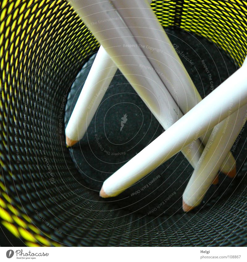 White pencils stand in a wire basket Pen Pencil Sharpened Long Thin Vertical Together Side by side Stand Mug Wire Tidy up Black Brown Green Bird's-eye view