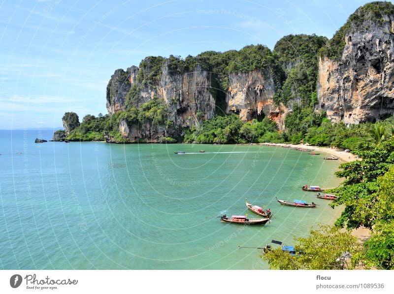 Ton Sai Beach on a sunny day with longtail boats Relaxation Vacation & Travel Ocean Climbing Mountaineering Landscape Forest Rock Watercraft Blue Turquoise