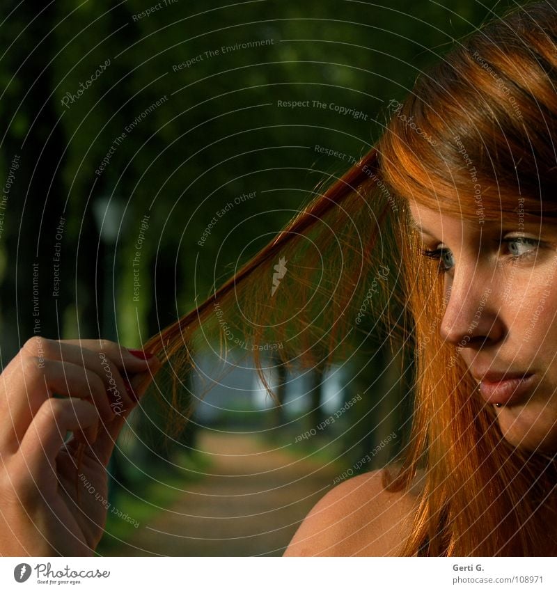 check Physics Proverb Hand Fingers Woman Young woman Red-haired Long-haired Piercing Henna red Hair colour Sunlight Red undertone Avenue Tree Row of trees