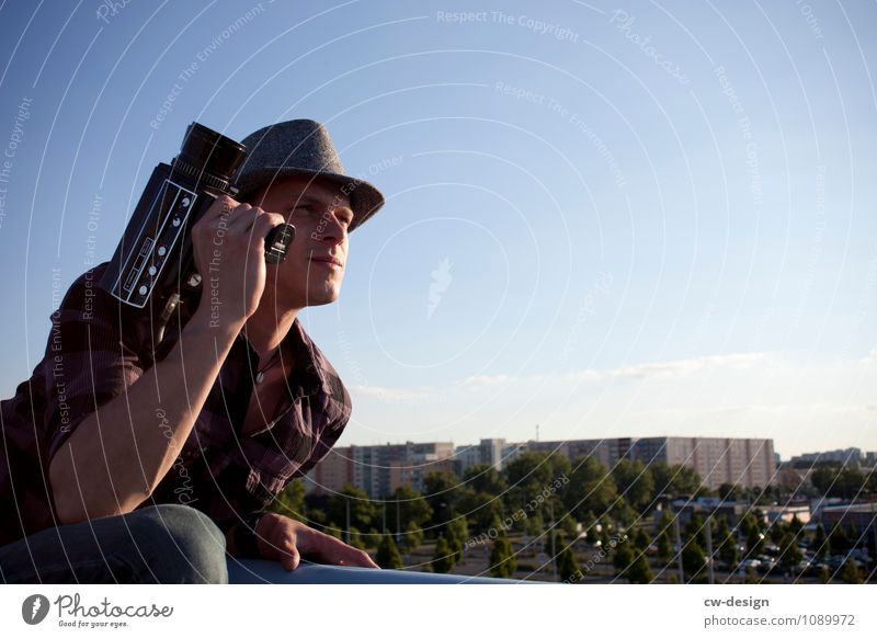 Teenager with Super 8 camera Sunlight Youth (Young adults) Cannon man with hat Human being Colour photo Weapon Man Video camera Film industry Young man