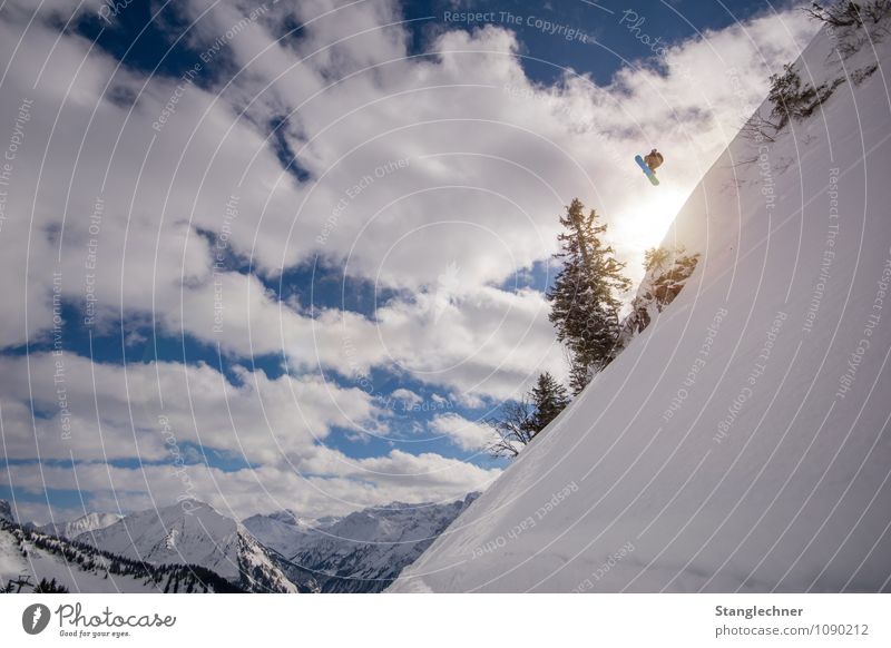 Over jump Sports Winter sports Sportsperson Deep snow Human being Masculine 1 Nature Landscape Sky Clouds Sun Sunlight Beautiful weather Tree Rock Alps Mountain