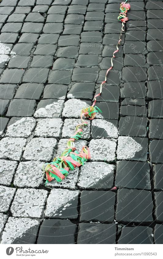 Streamers on paving stones - Somewhere in Italy (4). Rome Downtown Street Paper streamers Stone Signs and labeling Line Lie Esthetic Yellow Gray Green Red White