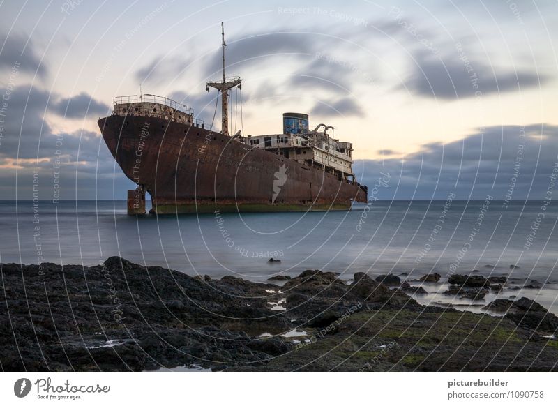 shipwreck Cruise Beach Ocean Coast Navigation Rust Old Wait Broken Gloomy Fear of the future Loneliness Sadness Transience Colour photo Exterior shot Deserted