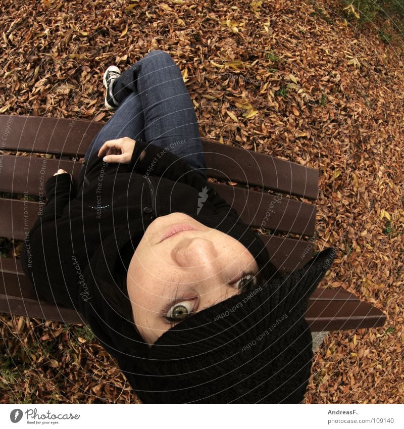 ParkBanking Autumn Park bench Autumn leaves Leaf Loneliness Woman Young woman Portrait photograph Relaxation Switch off Think Fisheye October November Cap Cold