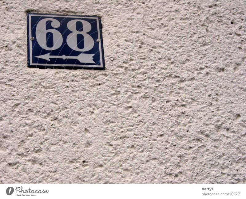 <___68 House number Digits and numbers Wall (building) sixty