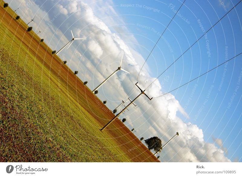 Clean Power. Green Wind energy plant White Brown Propeller Tree Bushes Technology Nature Clouds Sky Gale Force of nature Warped Electricity Industry