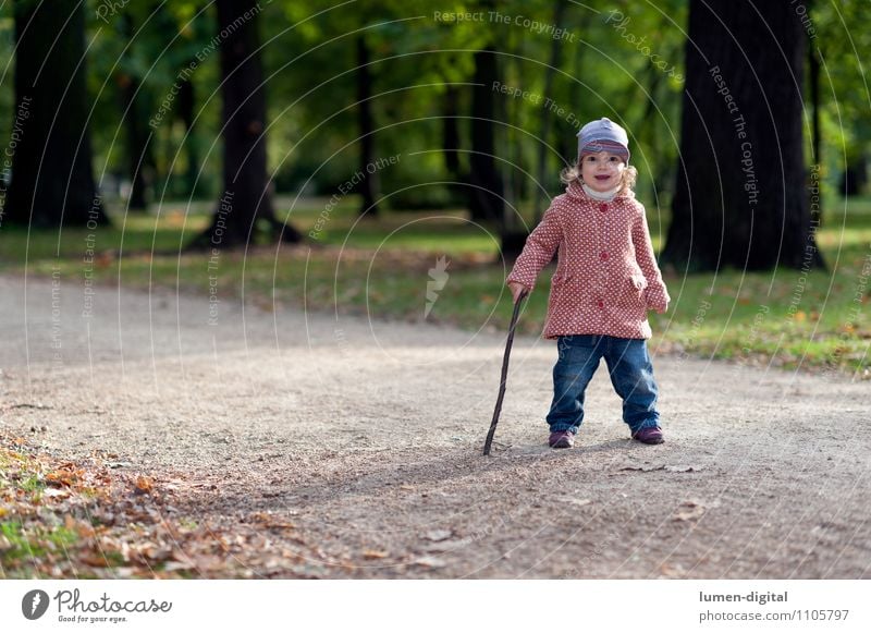 Child with walking stick Joy Athletic Hiking Girl 1 Human being 1 - 3 years Toddler Nature Autumn Park Coat Cap Going Laughter Friendliness Small on one's own