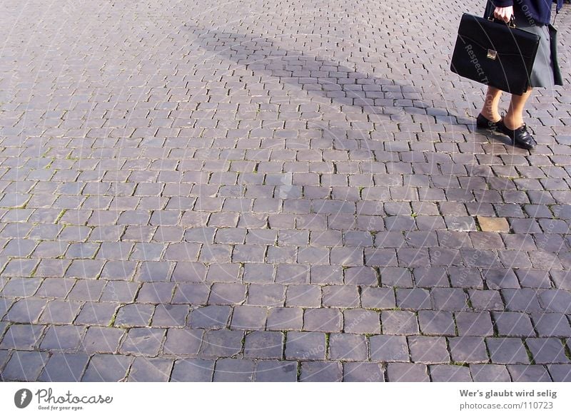 Legs of old woman with briefcase standing on cobblestone square Woman Old Snapshot Europe Italy Peter's square Gloomy Empty Suitcase Black File case Buckle