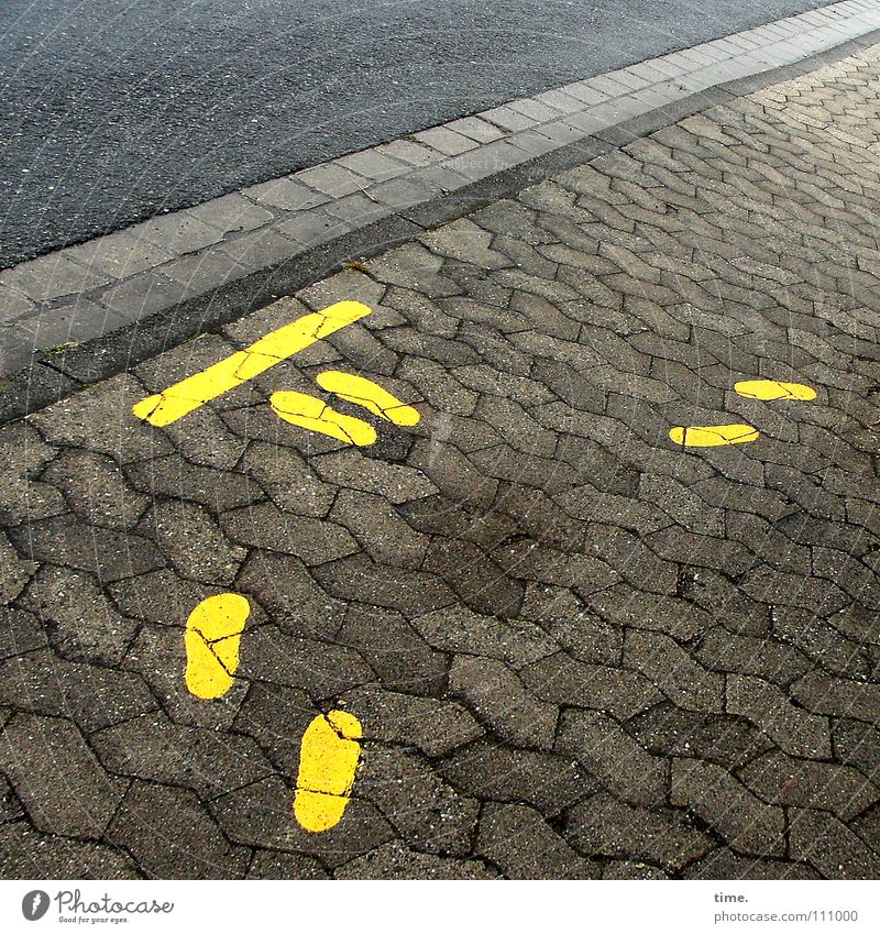 dash through the bill Colour photo Subdued colour Exterior shot Detail Deserted Morning Feet Street Stone Signs and labeling Signage Warning sign Graffiti Wait