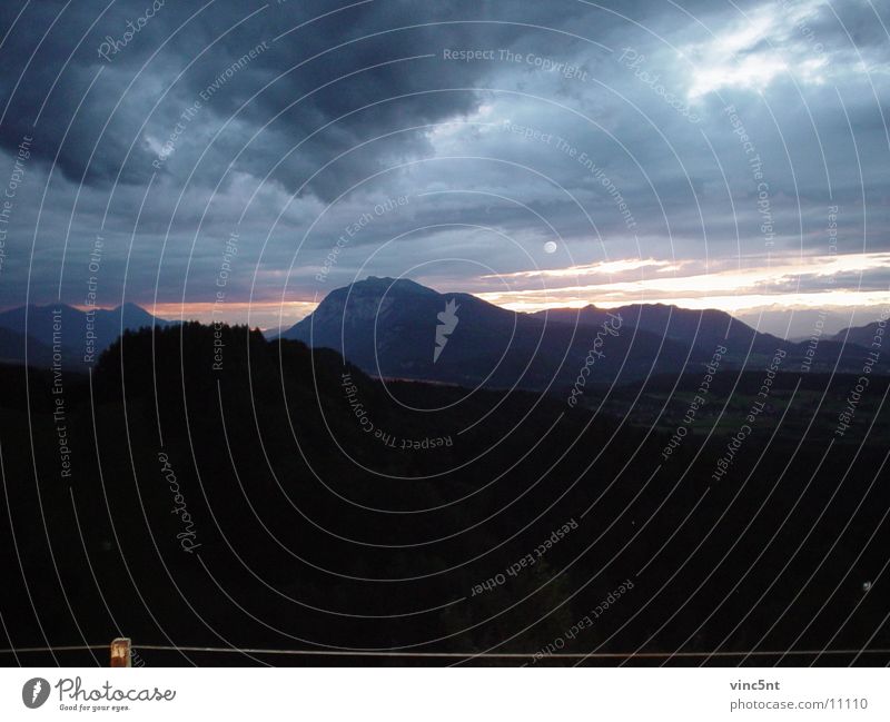 Sunset in the mountains Clouds Cloud cover Mountain Moon