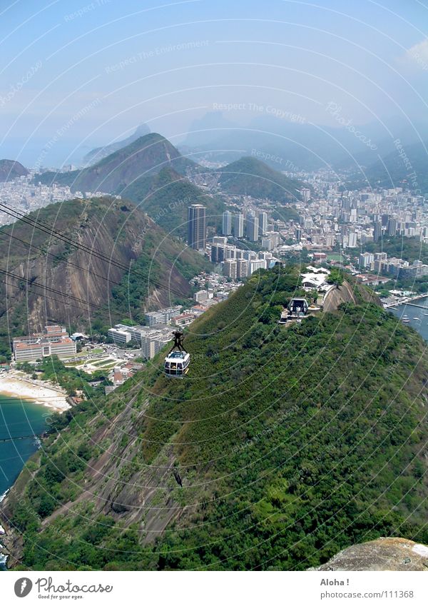 He's shoveling his luck! Rio de Janeiro Brazil Cable car Landmark Corcovado-Botafogo Vantage point Means of transport Hill Atlantic Ocean Ipanema South America